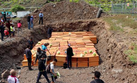 liberatedafricanreburial_09makingtributes copyright from The Slave Graves on Saint Helena Island Info About St Helena, in the South Atlantic Ocean (slavegraves.htm).jpg